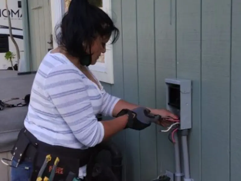 Licensed electrician wiring an exterior subpanel in Fussels Corner
